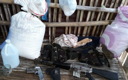<p><strong>CONFISCATED FROM THE REBELS.</strong> The firearms, ammunition and other items seized by joint army and police troopers after their encounter with the New People’s Army rebels at Sitio Puting Bato, Barangay Washington in Escalante City, Negros Occidental  Friday morning (November 16, 2018).  <em>(Photo courtesy of 303<sup>rd</sup> Infantry Brigade, Philippine Army)</em></p>