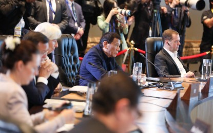 <p>President Rodrigo Roa Duterte joins other leaders from the Asia-Pacific Economic Cooperation (APEC) member countries during the Informal Dialogue with the International Monetary Fund at the APEC Haus in Port Moresby, Papua New Guinea on November 18, 2018. <em>(Rey Baniquet/Presidential Photo)</em></p>