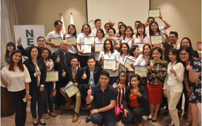 <p><strong>BUSINESS COACHING. </strong>Around 20 small and medium entrepreneurs (MSEs) from Cavite pose for posterity after finishing the Department of Trade and Industry's (DTI) Kapatid Mentor Me (KMME) Program in General Trias City, Cavite on Nov. 15, 2018. <em>(Photo courtesy of DTI Calabarzon)</em></p>