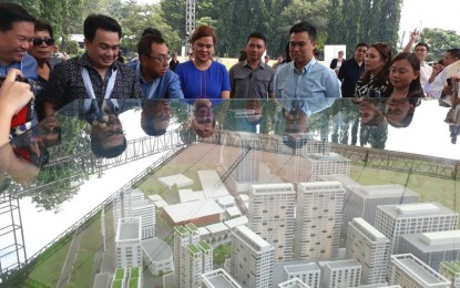 <p>Mayor Sara Z. Duterte gets a briefing on the Davao Global Township project in Matina, Davao City during the groundbreaking ceremony on Friday. <em><strong>PNA photo by Lilian C Mellejor</strong></em></p>