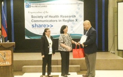 <p><strong>SCIENTIST FOR HIV/AIDS AWARENESS.</strong> Dr. Emmanuel S. Baja (right), a Balik Scientist, receives a recognition as speaker in the launching of the Society of Health Research Communicators (SHARE) in Region 10 on Tuesday (Nov. 27, 2018). Baja is one of the scientists behind a new mobile game app that seeks to raise public awareness on HIV/AIDS. <em>(Photo by LJ Bacolod, USTP-CDO intern)</em></p>