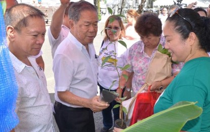 <p>Negros Occidental Governor Alfredo Marañon Jr. (2<sup>nd</sup> from left) with Provincial Agriculturist Japhet Masculino (left) checks out one of the booths in the ongoing 13<sup>th</sup> Negros Island Organic Farmers Festival held at the Capitol grounds in Bacolod City on Wednesday (November 28, 2018).  <em>(Photo courtesy of Negros Occidental Capitol PIO)</em></p>