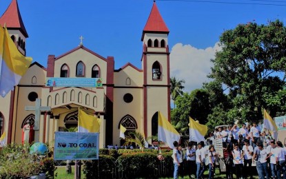 <p>Some of the youth-participants gather in front of the San Carlos Borromeo Cathedral before the caravan and walk for the environment in San Carlos City, Negros Occidental on Friday (November 30, 2018).  <em>(Photo courtesy of Social Action Center-San Carlos)</em></p>