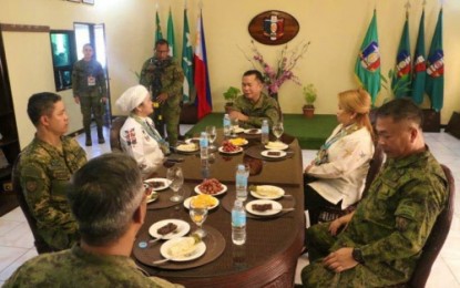 <p><strong>DIALOGUE.</strong> The Army's 6th Infantry Division commander, Major General Cirilito Sobejana (center), talks to Maguindanao 1st District Representative Bai Sandra Sema (left) and Cotabato City Mayor Frances Cynthia Guiani-Sayadi (right) during a dialogue held Monday (Dec. 3) inside Camp Siongco in Barangay Awang, Datu Odin Sinsuat, Maguindanao <em><strong>(Photo courtesy of 6th ID)</strong></em></p>