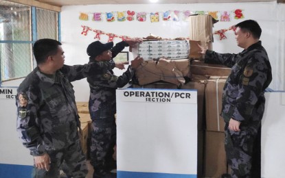 <p><strong>SMUGGLED CIGARETTES:</strong> Elements of the 2nd SOU-MG display the content of the assorted boxes of smuggled cigarettes they confiscated on December 3, 2018, in Balabac town. <em>(Photo courtesy of 2nd SOU-MG)</em></p>