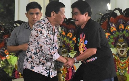 <p>Bacolod City Mayor Evelio Leonardia (right) welcomes President Rodrigo Duterte during the highlights of the 39<sup>th</sup> MassKara Festival at the Bacolod Public Plaza last October -- the third time the Chief Executive graced the world-renowned festival since 2016. <em>(File photo from Bacolod City PIO)</em></p>