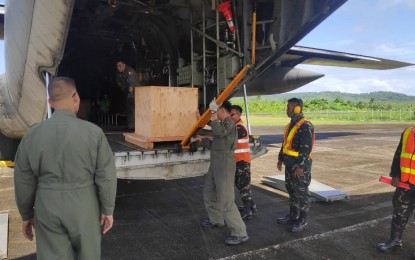 <p><strong>BALANGIGA BELLS BACK IN EASTERN SAMAR.</strong> Philippine Air Force personnel unload the Balangiga bells from the C-130 aircraft. The historic bells are now back in Eastern Samar after 117 years since American soldiers took them as war trophy during the Philippine-American War. <em>(Photo courtesy of PAF Public Affairs Office)</em></p>