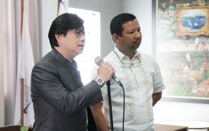 <p><strong>IMPOUNDING AREA</strong>. Land Transportation Office (LTO-7) Regional Director Victor Emmanuel Caindec listens as Presidential Assistant for the Visayas Michael Lloyd Dino speaks to the media during a the turnover of new plates to the motorists in Central Visayas, on July 5, 2018. <em>(File photo courtesy of Danjick Lim of the Office of the Presidential Assistant for the Visayas)  </em></p>