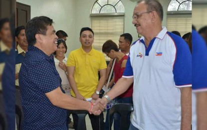<p>Executive Assistant to the Governor Angel Verdeflor (right) welcomes Isabela Mayor Joselito Malabor at the Negros Occidental Provincial Capitol on Tuesday (December 18, 2018) for the turn-over of project funds to barangay officials from the municipality. <em>(Photo by Richard Malihan/Negros Occidental Capitol PIO)</em></p>