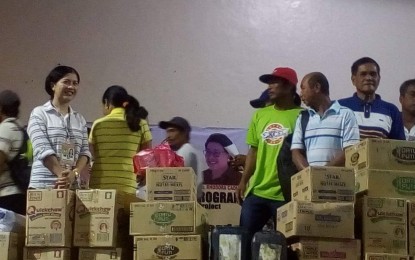 <p>A total of 287 beneficiaries from the informal sector receive assistance from the Department of Labor and Employment Integrated Livelihood and Emergency Program at the Evelio B. Javier Gymnasium in San Jose de Buenavista, Antique on Thursday (December 20, 2018).  <em>(Photo by Annabel Petinglay)</em></p>