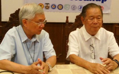 <p>Bishop Patricio Buzon (left) and Negros Occidental Alfredo Marañon Jr. talk after the signing of the partnership agreement for the implementation of the 'Panggas' Tree-Growing Project of the Diocese of Bacolod at the conference room of the Bishop’s House on Wednesday (December 19, 2018). <em>(Photo by Nanette L. Guadalquiver)</em></p>
<p> </p>
<p> </p>