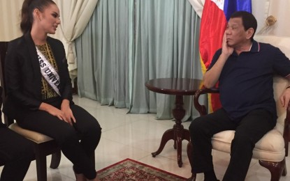 <p><strong>MISS U AND THE PRESIDENT.</strong> 2018 Miss Universe Catriona Gray of the Philippines makes a courtesy call on President Duterte at the Villamor Air Base on Thursday evening (Dec. 20, 2018).<em> (Photo courtesy of Presidential Spokesperson Salvador Panelo)</em></p>
