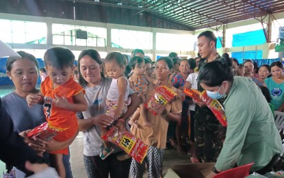 <p>Some flood victims in Jipapad, Eastern Samar receive noche buena products in a gift-giving activity led by Tacloban-based journalists. <em>(Photo courtesy of Marie Tonette Grace Marticio)</em> </p>