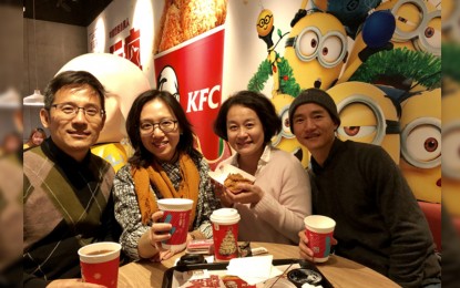 <p>The author (left) together with his classmates Guan, Yin and Liang at the KFC store in Qianmen, Beijing on December 8, 2018. <em>(Photo by China Plus)</em></p>
