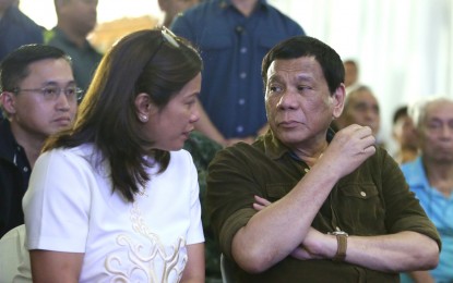 <p><strong>DUTERTE VISITS SLAIN SOLON'S WAKE.</strong> President Rodrigo R. Duterte condoles with Gertie, wife of late Ako Bicol Partylist Representative Rodel Batocabe, as he visits the late lawmaker's wake at Bicol University in Daraga, Albay on December 26, 2018. President Duterte raised the bounty from P30-million to P50-million for the arrest of the suspects in the killing of the late party-list representative. <em>(Alfred Frias/Presidential Photo) </em></p>