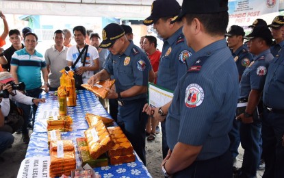 <p><strong>STORE SURVEY.</strong> Philippine National Police  Chief, Director General Oscar Albayalde, inspects one of the products in one of the stalls they checked in Bocaue, Bulacan on Friday (December 28, 2018). The inspection was  conducted check if the stores have proper permits from the PNP, as well as their compliance with the laws prohibiting the sale of firecrackers and other pyrotechnic devices that may cause injuries or death during New Year’s Eve celebration. <em>(Photo courtesy of Radyo ng Bayan) </em></p>