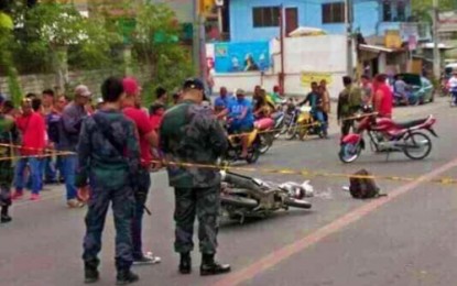 <p>SEALED OFF. Police close down with police yellow tape the area in Sinsuat Avenue, Cotabato City, where a riding-in-tandem attacked and shot two Army on Friday (Dec. 28). <em><strong>(Photo courtsey of City Transport Traffic Office)</strong></em></p>