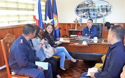 <p>Presidential Communications Operations Office (PCOO) Assistant Secretary Marie Rafael, together with Philippine Information Agency (PIA) Cordillera Regional Director Helen Tibaldo, meets with Police Regional Office Cordillera (PROCOR) Director Chief Supt. Rolando Nana on January 3 to finalize preparations for the shootfest fundraising event on January 5 and 6 at the regional police’ headquarters. <em>(Photo courtesy of Redjie Melvic Cawis/ PIA-CAR)</em></p>