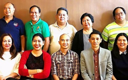 <p>John Dave Dueñas (seated, center) with some of the officers of Bacolod-Negros Occidental Federation for Information and Communications Technology after their election last year. <em>(File photo from BNEFIT)  </em></p>