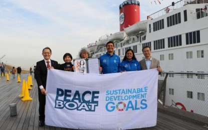 <p>Peace Boat representatives, including actor/model and clean energy advocate Illac Diaz (third from right), take a commemorative photo before the ship's departure. <em>(Photo courtesy of Peace Boat)</em></p>