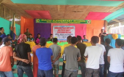 <p><strong>DRUG SURRENDERERS.</strong> The 41 members of the illegal drug group operating in Sultan sa Barongis, Maguindanao during the ceremonial surrender rites conducted by the military and local officials on Friday (Jan. 11) in remote Barangay Bulod. <em>(Photo courtesy of  33rd Infantry Battalion)</em></p>
