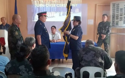 <p><strong>CHANGE OF COMMAND.</strong> Supt. Alberto Garcia (left) leads the turnover of the flag to Supt. Joie Pacito Yape, Jr. as the new chief of Calbayog city police office on  Wednesday (Jan 16, 2019). <em>(Photo courtesy of Calbayog Police Office) </em></p>