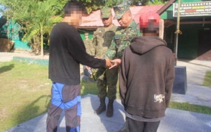 <p><strong>REBELS GIVE UP.</strong> Two members of the New People’s Army, identified only as Ka Jongie and Ka Fred, yielded to the military in simple ceremony at the headquarters of the Army’s 33rd Infantry Battalion in President Quirino, Sultan Kudarat held Wednesday (Jan. 16, 2019). <em>(Photo courtesy of 6ID)</em></p>