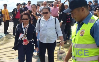 <p><strong>VISIT TO FAVE PROJECTS.</strong> House Speaker Gloria Macapagal-Arroyo boards a roll-on, roll-off vessel bound for Dumangas, Iloilo at the Bredco port in Bacolod City, after her visit to the Bacolod-Silay Airport in Silay City on Friday (Jan. 18, 2019). Arroyo visited the Bacolod-Silay Airport in Negros Occidental during the 11th anniversary of its operations on Friday as part of her “sentimental journey” to her favorite projects in the country. <em>(Photo from Gloria Macapagal Arroyo, Beat the Odds Facebook page)</em></p>
<p><em> </em></p>