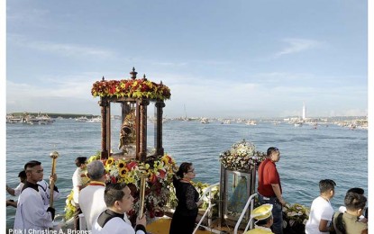 <p>HOLY MOTHER AND CHILD. The images of Señor Sto. Niño (left) and Our Lady of Guadalupe aboard the Galleon, provided by Roble Shipping Corp., during the fluvial procession. (<em>Photo courtesy of Basilica Minore del Sto. Niño/Christine A. Briones</em>)</p>