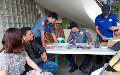 <p><strong>SEARCH WARRANT.  </strong>Criminal Investigation and Detection Group (CIDG)-Bicol operatives serve two search warrants to Daraga town mayor Carlwyn Baldo (seated, second from left) for illegal possession of firearms and recovery of vehicle, Jan. 22, 2019. <em>(Photo contributed by Remy Mendones)<strong> </strong></em></p>