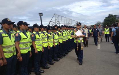 <p><strong>BLESSING OF TROOPS.</strong> Rev. Fr. Gilbert C. Ilagan leads the blessing of troops during  Dinagyang sendoff ceremony held at the new Dinagyang Grandstand on Thursday (Jan. 24, 2019). Close to 3,000-strong government forces and force multipliers will secure this year’s Dinagyang festival. <em>(Photo by Leonora Estanque)</em></p>