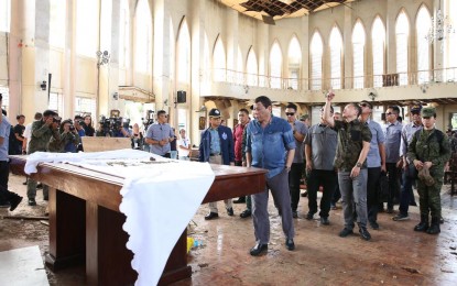 <p>President Rodrigo Roa Duterte conducts an inspection inside the Cathedral of Our Lady of Mount Carmel in Jolo, Sulu on January 28, 2019 where two explosions occurred inside and outside the church last January 27. <em>(Photo of Albert Alcain/Presidential Photo)</em></p>