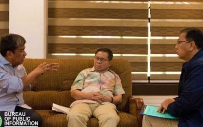<p><strong>PEACEFUL TRANSITION.</strong> Autonomous Region in Muslim Mindanao Governor Mujiv Hataman (left) suggests a point for the smooth transition of the current ARMM set up to the new Bangsamoro political entity during a meeting with Moro Islamic Liberation Front chief Al Haj Murad (center) and Office of the Presidential Assistant to the Peace Process Secretary Carlito Galvez (right) in Cotabato City on Wednesday (Jan. 30, 2019. <em>(Photo by BPI-ARMM)</em></p>