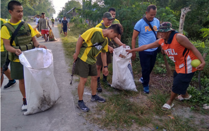 <p><strong>CLEAN UP.</strong> Soldiers, policemen, and civilians work side-by-side in cleaning their communities in the towns of Sultan sa Barongis, Rajah Buayan, Shariff Saydona Mustapha, and Shariff Aguak, all in Maguindanao, on Friday (Feb. 1, 2019). <em><strong>(Photo courtesy of 40th IB)</strong></em></p>