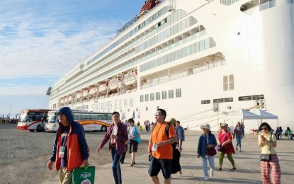 <p>Cruise line guests and visitors arrive at the Omnico seaport. <em>(File photo courtesy of Tourism Ilocos Norte)</em></p>
