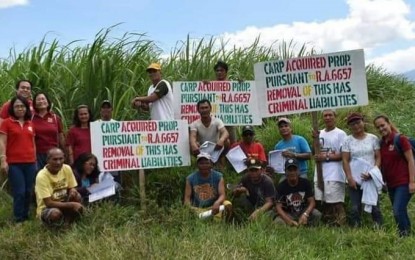 <p>The 46 installed Agrarian Reform Beneficiaries in Barangay Caliban in Murcia, Negros Occidental  of Municipal Agrarian Reform Program Office and personnel of the Department of Agrarian Reform Negros Occidental-Northpose for a picture on Wednesday (Feb. 7, 2019). <em>(Photo courtesy of DAR-Negros Occidental North)</em></p>