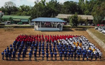 <p>A Philippine human flag was formed as Ilocanos recited the Prayer for Peace in the Philippines.<em> (Photo courtesty of the Ilocos Norte Police Provincial Office)</em></p>
