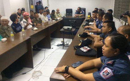 <p><strong>MEETING FOR PEACE.</strong> Senior Supt. Henry Biñas (center), officer-in-charge director of Bacolod City Police Office, and the chiefs of the 10 police stations meet with the leaders of the local Muslim community (left) to discuss peace-related issues at the city police headquarters on Friday afternoon (Feb. 8, 2019)  <em>(Photo courtesy of Shiela G. Gelera) </em></p>