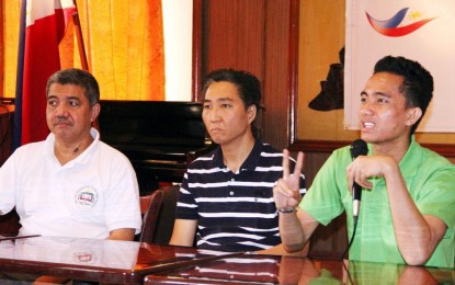 <p>John Russell Misal (right) of Davao City answers a question from sportswriters during the 10th TOPS “Usapang Sports” a the National Press Club. With him in photo are TATAND honorary president Charlie Lim (center) and TOPS president Ed Andaya of People’s Tonight. <em>(Photo courtesy of TOPS)</em></p>