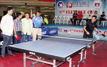 <p><strong>TOP BET.</strong> John Russell Misal in action during a demonstration game after the opening ceremony of the 9th Flexible Cup International Table Tennis Championships at the Harrison Plaza Activity Center on Friday (Feb. 15, 2019). Looking on are (L-R) Presidential Anti-Corruption Commission head Greco Belgica, Philippine Sports Commission (PSC) Commissioner Charles Maxey, Table Tennis Association for National Development (TATAND) founder Charlie Lim. <em>(PNA photo by Jess Escaros)</em></p>