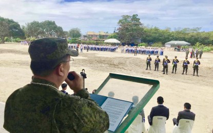 <p><strong>SOURCE OF MILITARY OFFICERS.</strong> University of Professor Antonio Esmero, an Army reservist lieutenant colonel and head of the 701st Cebu Ready Reserve Battalion, delivers his message as the graduates of the Reserve Officer Training Corps (ROTC) and membes of the faculty in Lapu-Lapu City College listen. <em>(Photo contributed by Lt. Col. Antonio Esmero)</em></p>