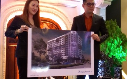 <p>Rachelle Peñaflorida, vice president for sales and marketing of Megaworld Bacolod, and Harold Geronimo, Megaworld senior assistant vice president and head of public relations and media affairs, lead the launching of The Upper East’s Two Regis residential tower during a press conference at Stonehill Suites in Bacolod City on Monday. <em>(Photo by Nanette L. Guadalquiver)</em></p>