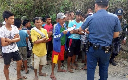 <p><strong>SCENE OF THE CRIME.</strong> Policemen gather information from possible witnesses at the scene where Jonybert “Jun-Jun” Sabeco was gunned down by four New People’s Army rebels in Purok Letter, Barangay Camansi in Kabankalan City, Negros Occidental on Tuesday, Feb. 19, 2019. <em>(Photo courtesy of 15<sup>th</sup> Infantry Battalion, Philippine Army)</em></p>
<p> </p>