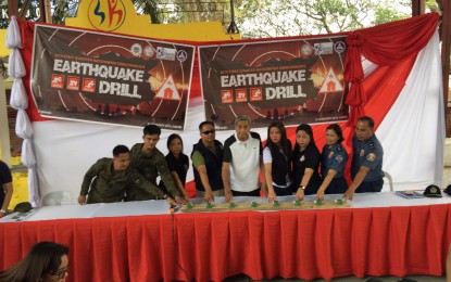<div><strong>QUAKE DRILL.</strong> Angat, Bulacan Mayor Narding De Leon (center) leads the ceremonial pressing of the button to signal the start of the conduct of the 2019 1st Quarter Nationwide Simultaneous <span class="il">Earthquake</span> <span class="il">Drill</span> held at the covered court of Barangay Sto. Cristo, Angat, Bulacan on Thursday, Feb. 21, 2019. <em>(Photo courtesy of PIA Bulacan)</em></div>