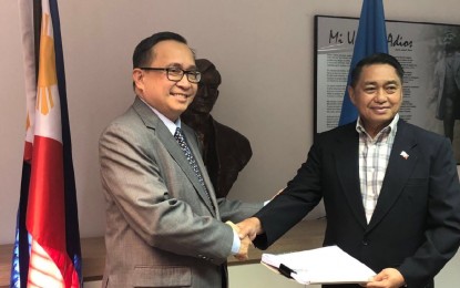 <p>National Security Council Deputy Director General Vicente Agdamag (right) on Feb. 21 hands over to Ambassador Evan P. Garcia, Philippine Permanent Representative to the United Nations and other International Organizations in Geneva, the documents containing the official complaints of the different tribal communities represented by the Mindanao Indigenous People Council for Peace and Development pertaining to the 17 atrocities committed by the Communist Party of the Philippines - New Peoples Army – National Democratic Front (CPP-NPA-NDF). The complaints will be submitted to the United Nations Office of the High Commissioner for Human Rights. <em>(PNA photo by Gigie Arcilla-Agtay)</em></p>