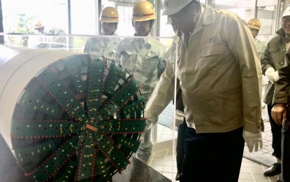 <p>Department of Transportation (DOTr) Secretary Arthur Tugade inspects tunnel boring machines to be used for the construction of the Metro Manila Subway system. <em>(Photo courtesy of Department of Transportation) </em></p>
