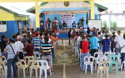 <p><strong>ALLEGIANCE TO THE GOV'T.</strong> Some 80 former members and mass supporters of the Communist Party of the Philippines-New People’s Army from five villages in northern Negros take their oath of allegiance to the government in a ceremony held at the covered court of Barangay 5 inVictorias City on Friday (Feb. 22, 2019). <em>(Photo courtesy of 79<sup>th</sup> Infantry Battalion, Philippine Army) </em></p>
