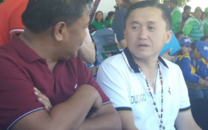 <p>Former Special Assistant to the President Christopher Lawrence Go and Kalinga Gov. Jocel Baac talk during Go's visit in Apayao province for the opening program of the Cordillera Administrative Region Athletic Association (CARAA) on Wednesday. <em>(Photo by Liza T. Agoot)</em></p>