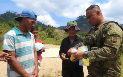 <p>Lt. Colonel Harold Cabunoc, outgoing Army's 33rd Infantry Battalion commander, teaches members of the Indigenous Peoples community in Bagumbayan, Sultan Kudarat how to operate a solar torch his unit had provided the tribe. <em><strong>(Photo courtesy of 33rd IB)</strong></em></p>