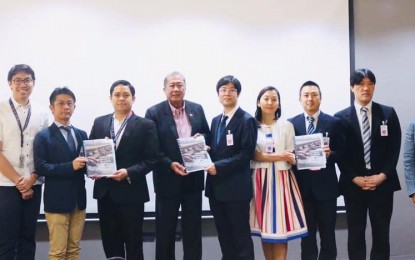 <p>Officials from the Department of Transportation and the Japan International Cooperation Agency hold their copies of the approved curriculum of the Philippine Railway Institute. <em>(Photo courtesy of Department of Transportation) </em></p>